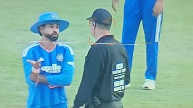 India captain Shreyas Iyer (L) speaks with the on-field umpire over the wide ball in the final over of the match.
