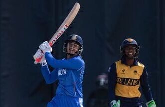 India's Smriti Mandhana plays a shot in front of Sri Lanka's Kaushini Nuthyangana in the women's gold medal match at Asian Games 2026.