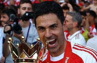Arsenal manager Mikel Arteta celebrates with the trophy after winning the Premier League. (File photo)