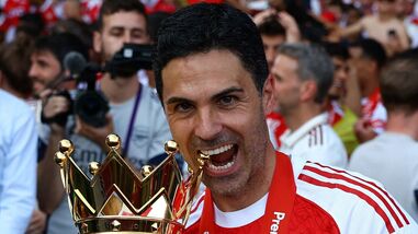 Arsenal manager Mikel Arteta celebrates with the trophy after winning the Premier League. (File photo)