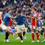 Brighton and Hove Albion's Chema Andres celebrates scoring their third goal with Luka Vuskovic