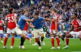 Brighton and Hove Albion's Chema Andres celebrates scoring their third goal with Luka Vuskovic
