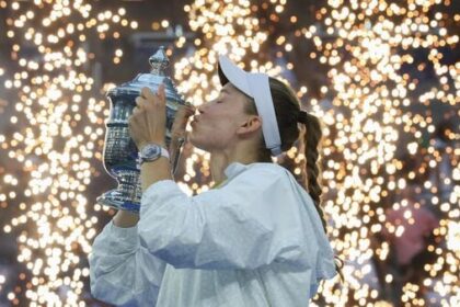 Kazakhstan's Elena Rybakina kisses the winner's trophy after winning the women's singles title at the 2026 US Open in New York on Saturday.