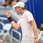 Alex Michelsen reacts as he plays Frances Tiafoe in their men's singles quarterfinal tennis match