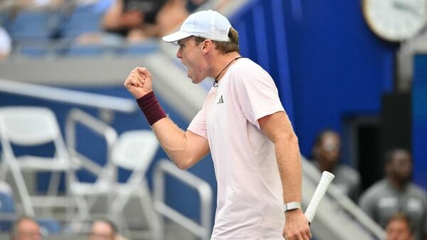 Alex Michelsen reacts as he plays Frances Tiafoe in their men's singles quarterfinal tennis match