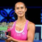 Canada's Leylah Fernandez poses with the trophy after beating Australia's Talia Gibson to win the WTA Singapore Open tennis final in Singapore.