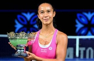 Canada's Leylah Fernandez poses with the trophy after beating Australia's Talia Gibson to win the WTA Singapore Open tennis final in Singapore.