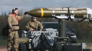 US-Israel-Iran War: US Military personnel take away Joint Direct Attack Munitions (JDAMs), removed from a US Air Force B-1 Lancer bomber at RAF Fairford in south-west England on 15 March 2026. Fairford is one of two bases, along with the Diego Garcia facility in the Indian Ocean, that the UK has given the US permission to use for 'specific defensive operations into Iran' to destroy Iranian missiles at source, the British defence minister said in a statement. (Photo by Henry NICHOLLS / AFP) (file photo)