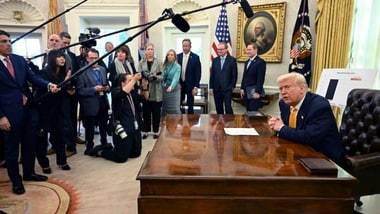 A file image of President Donald Trump speaking with reporters in the Oval Office of the White House in Washington.