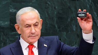 Israeli Prime Minister Benjamin Netanyahu holds up a pager as he addresses the 81st United Nations General Assembly (UNGA) at UN headquarters in New York City, US, September 24, 2026.   REUTERS/Mike Segar