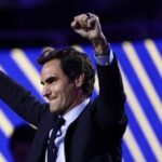 Roger Federer, former tennis player, gestures after he got his Hall of Fame ring at the U.S. Open tennis championships Monday, Aug. 31, 2026, in New York. (AP Photo/Adam Hunger)