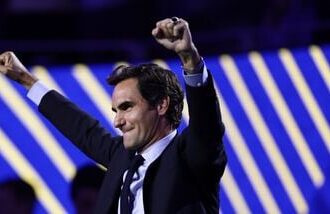 Roger Federer, former tennis player, gestures after he got his Hall of Fame ring at the U.S. Open tennis championships Monday, Aug. 31, 2026, in New York. (AP Photo/Adam Hunger)
