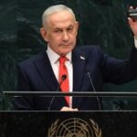 Israel's Prime Minister Benjamin Netanyahu holds up a pager as he speaks during the 81st United Nations General Assembly at the United Nations Headquarters in New York, on September 24, 2026. (Photo by TIMOTHY A. CLARY / AFP)