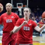 Angel Reese, of the United States, left, and United States' Caitlin Clark in action