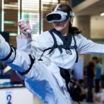 A virtual taekwondo competitor performs a high kick during a competitive event in Kuala Lumpur, Malaysia