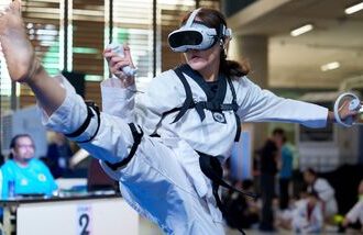 A virtual taekwondo competitor performs a high kick during a competitive event in Kuala Lumpur, Malaysia