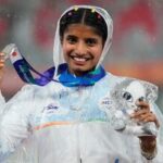 Ancy Sojan poses for a photograph with women's long jump silver medal at the Asian Games 2026.