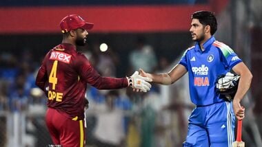 Indian skipper Shubman Gill shakes hands with the West Indies skipper Shai Hope after the 2nd ODI at Barsapara Cricket Stadium, in Guwahati on Wednesday.