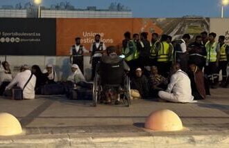 People gather outside a metro station on the road to King Khalid International Airport in Riyadh, Saudi Arabia, Saturday, Oct. 10, 2026. (AP/PTI)(AP10_11_2026_000002B)