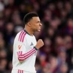 Real Madrid's Kylian Mbappe celebrates after scoring his side's second goal during a Spanish La Liga match against Barcelona.