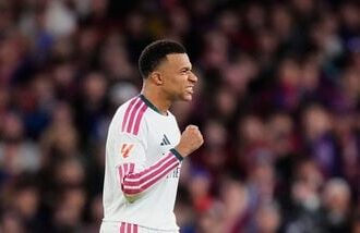 Real Madrid's Kylian Mbappe celebrates after scoring his side's second goal during a Spanish La Liga match against Barcelona.