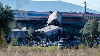 Emergency services attend to the victims at the scene of a collision between two trains in Urda, Spain, on Wednesday.