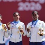 Asian Games 2026 Live Updates, Day 14: Gold medallist India's Kumkum Anil Mohod, Ankita Bhakat and Kirti celebrate on the podium during the victory ceremony.