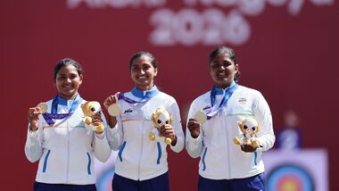 Asian Games 2026 Live Updates, Day 14: Gold medallist India's Kumkum Anil Mohod, Ankita Bhakat and Kirti celebrate on the podium during the victory ceremony.