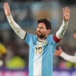 Argentina's Lionel Messi celebrates after scoring his team's third goal from the penalty spot during his final match for the national team against Benin in Buenos Aires.