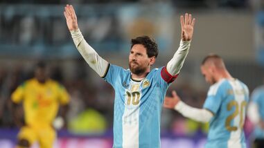 Argentina's Lionel Messi celebrates after scoring his team's third goal from the penalty spot during his final match for the national team against Benin in Buenos Aires.