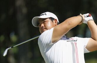 South Korea's Tom Kim, also known as Kim Joo-hyung, plays a shot in the men’s singles in golf at the Asian Games.