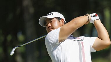 South Korea's Tom Kim, also known as Kim Joo-hyung, plays a shot in the men’s singles in golf at the Asian Games.