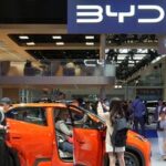 Visitors check a BYD Seagull electric vehicle (EV) displayed at the Beijing International Automotive Exhibition, or Auto China, in Beijing, China