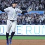 New York Yankees shortstop Anthony Volpe (11) reacts after a double because of fan interference during the sixth inning against the Tampa Bay Rays in game three of the ALDS for the 2026 MLB Playoffs at Yankee Stadium.