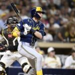 Milwaukee Brewers designated hitter Christian Yelich (22) runs to first after hitting a single during the fifth inning against the San Diego Padres in game four of the NLDS for the 2026 MLB Playoffs at Petco Park.