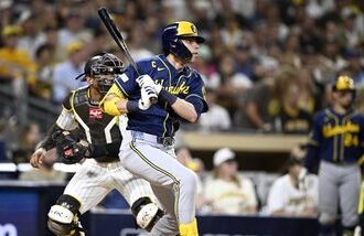 Milwaukee Brewers designated hitter Christian Yelich (22) runs to first after hitting a single during the fifth inning against the San Diego Padres in game four of the NLDS for the 2026 MLB Playoffs at Petco Park.