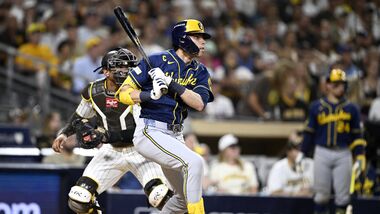 Milwaukee Brewers designated hitter Christian Yelich (22) runs to first after hitting a single during the fifth inning against the San Diego Padres in game four of the NLDS for the 2026 MLB Playoffs at Petco Park.
