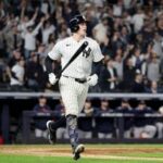 Ben Rice #22 of the New York Yankees celebrates as he round the bases after hitting a grand slam home run against the Boston Red Sox during the eighth inning in game one of the American League Wild Card Series at Yankee Stadium.