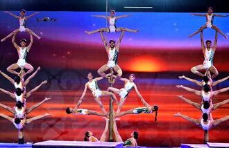 Indian Athletes perform Yoga Sana and Mallakhamb during a demonstration of indigenous sports by various BRICS participating nations after the inauguration of BRICS Traditional and Indigenous Demonstration Games 2026 at Veer Savarkar Sports Complex, in Ahmedabad.