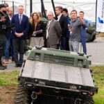 Minister of National Defense David McGuinty is shown a Rheinmetall Mission Master SP, an electric unmanned ground vehicle (UGV) made in Canada, during GCXpo 2026, a demonstration showcase of Canadian next-gen tech, at Area X.O in Ottawa, on Tuesday, Sept. 29, 2026. (Justin Tang /The Canadian Press via AP)