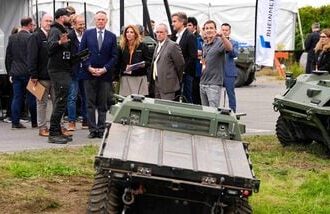 Minister of National Defense David McGuinty is shown a Rheinmetall Mission Master SP, an electric unmanned ground vehicle (UGV) made in Canada, during GCXpo 2026, a demonstration showcase of Canadian next-gen tech, at Area X.O in Ottawa, on Tuesday, Sept. 29, 2026. (Justin Tang /The Canadian Press via AP)