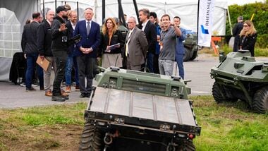 Minister of National Defense David McGuinty is shown a Rheinmetall Mission Master SP, an electric unmanned ground vehicle (UGV) made in Canada, during GCXpo 2026, a demonstration showcase of Canadian next-gen tech, at Area X.O in Ottawa, on Tuesday, Sept. 29, 2026. (Justin Tang /The Canadian Press via AP)