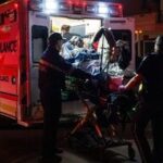Paramedics load an injured person into an ambulance at the Wainwright Health Centre as injured military members are treated after a fire at Canadian Forces Base Wainwright, outside of Wainwright, Alberta Saturday, Oct. 17, 2026. (John Ulan/The Canadian Press via AP)