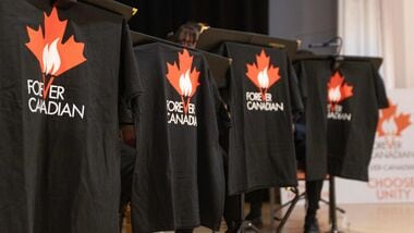 Forever Canadian T-shirts hang on display at a pro-Canada rally at Polish Hall in downtown Edmonton, Alberta, ahead of the referendum results on October 19, 2026. Alberta votes today to determine if it wants to pursue a binding referendum on leaving Canada, with Prime Minister Mark Carney warning a separatist win would bring dangerous uncertainty during a trade war with the United States. Polls indicate less than a quarter of people in the western Canadian province support independence. (Photo by Megan Albu / AFP)