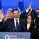 Parti Quebecois Leader Paul St-Pierre Plamondon, center, speaks to supporters after winning the provincial election in Montreal, Quebec on Monday, Oct. 5, 2026. (Graham Hughes/The Canadian Press via AP)