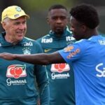 Brazil's Italian head coach Carlo Ancelotti (L) speaks with Vinicius Junior during a training session in Kolkata ahead of India tie.