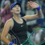 Mirra Andreeva, of Russia, celebrates after defeating Ekaterina Alexandrova, of Russia during the quarterfinals of the women's singles match at the China Open tennis tournament in Beijing.