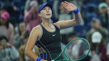 Mirra Andreeva, of Russia, celebrates after defeating Ekaterina Alexandrova, of Russia during the quarterfinals of the women's singles match at the China Open tennis tournament in Beijing.