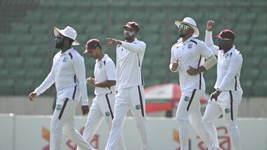 West Indies' captain Roston Chase (C) walks onto the field alongwith his teammates on the fourth day of the first test cricket match between Bangladesh and West Indies.