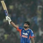 India's captain Shreyas Iyer (L) celebrates after scoring his century during the first T20 international cricket match between India and West Indies at the Ekana cricket stadium in Lucknow.